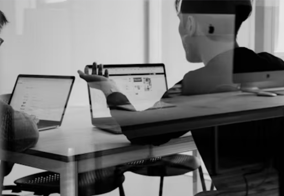 People working at laptops on a table